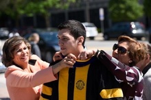 student in cap and gown for graudation