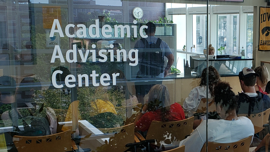 students sitting the the reception area of the Academic Advising Center